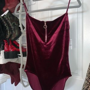 ARDENE: maroon velvet body suit with zip up front.